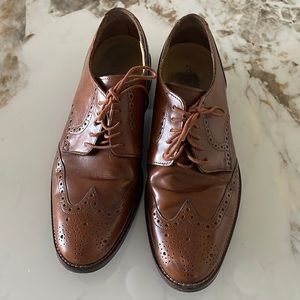 Men’s classic Cole Haan wing tip oxfords.